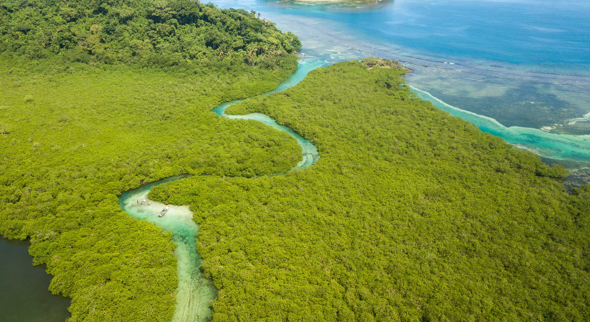 turquoise river that flows into the Atlantic Ocean in Panama